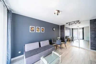 a living room with a couch and a table at Kaskada in Kraków