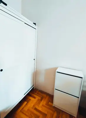 a white door in a room with a wooden floor at Krakow City Stay Vintage in Kraków