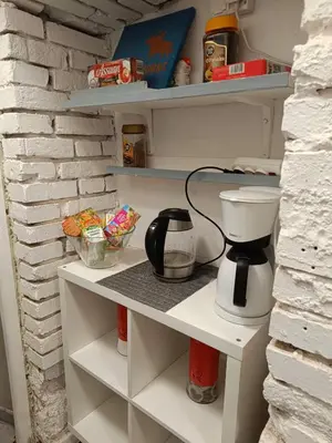 a coffee maker on a shelf in a refrigerator at Room 1 industrial in Kraków