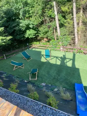 an aerial view of a yard with chairs and a shadow at Brda 5 osobowa z jacuzzi in Zawoja