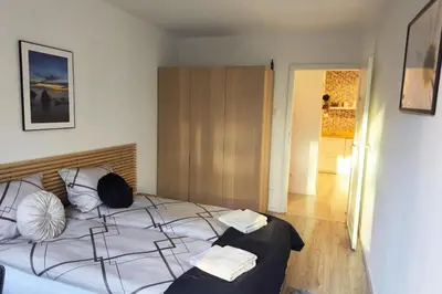 a bedroom with a bed with two pillows on it at Old Town Retreat Cracow in Kraków
