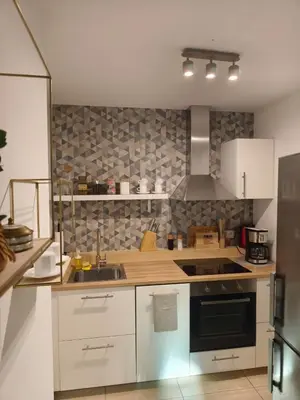 a kitchen with a sink and a stove at Old Town Retreat Cracow in Kraków