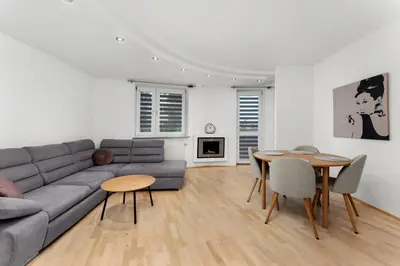 a living room with a couch and a table at Pod Fortem Homely Apartment by BookingHost in Kraków