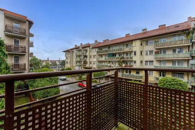 a balcony with a view of some apartment buildings at Pod Fortem Homely Apartment by BookingHost in Kraków