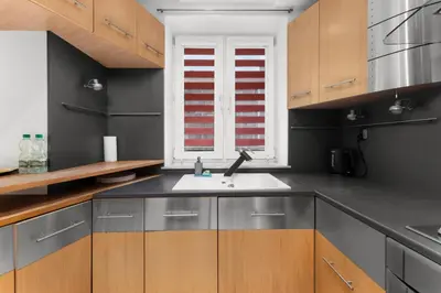 a kitchen with a sink and a window at Pod Fortem Homely Apartment by BookingHost in Kraków