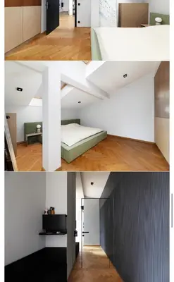 a room with white walls and a bed in a room at M&D Apartment in Kraków