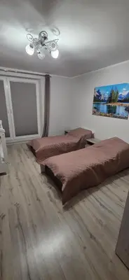 a bedroom with two beds and a ceiling fan at W Rabczańskiej Dolinie 2 in Rabka