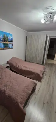 a bedroom with two beds and a ceiling fan at W Rabczańskiej Dolinie 2 in Rabka