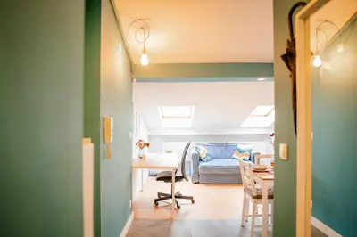 a room with a desk and a bed and a table at Podgórze Studio - Air Con, Workdesk, Castle Nearby in Kraków