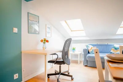 a home office with a desk and a chair at Podgórze Studio - Air Con, Workdesk, Castle Nearby in Kraków