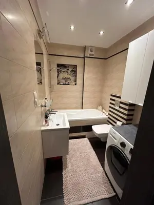 a bathroom with a sink and a tub and a toilet at Garden Spot and Parking in Kraków