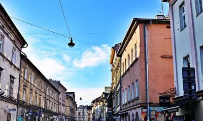 a city street with buildings and a street light at Old Town Apt Józefa Street 22 in Kraków