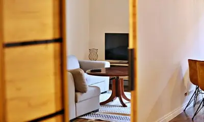 a living room with a couch and a table at Old Town Apt Józefa Street 22 in Kraków