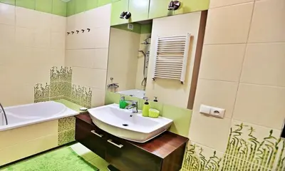 a bathroom with a sink and a mirror at Old Town Apt Józefa Street 22 in Kraków