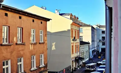 a view of a city street with buildings at Old Town Apt Józefa Street 22 in Kraków