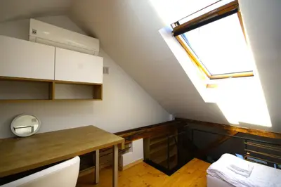 a room with a dining table and a window at Atmospheric Apartment close to Old Town by Rently in Kraków