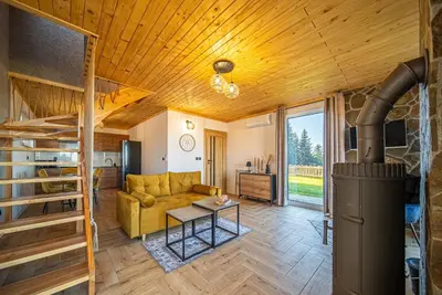 a living room with a couch and a table at Osada Golców