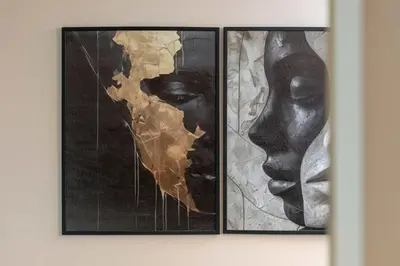two framed paintings of a woman on a wall at Air Conditioned Apartment in Cracow with Parking and Desk by Noclegi Renters in Kraków