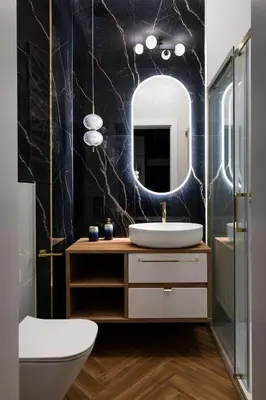 a bathroom with a sink and a mirror at Soho Residence Kraków by Downtown Apartments in Kraków