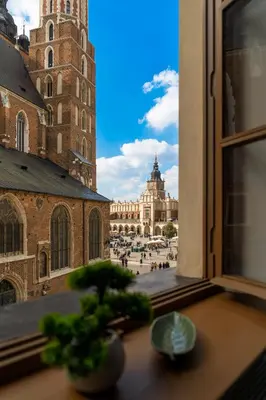 a view of a city from a window of a building at Main Square Prestige Suites by Staymoovers in Kraków