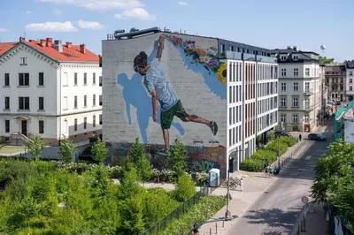 a mural of a man on the side of a building at Spacious cental treasure in Kraków