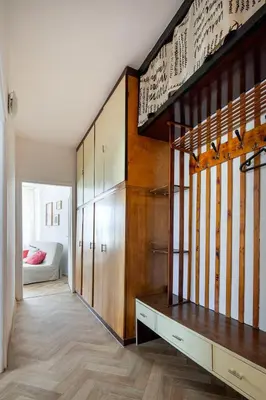 a room with a large wooden closet and a staircase at Spacious cental treasure in Kraków