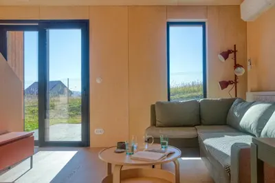 a living room with a couch and a table at Brzozowy Rożnów in Rożnów
