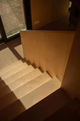 a wooden floor with the light coming through a door at Brzozowy Rożnów in Rożnów