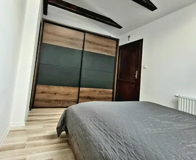 a bedroom with a large sliding glass door at Golden Middle Point - best location in Krakow in Kraków