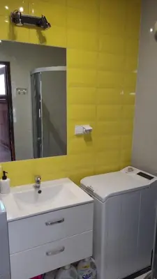 a bathroom with a sink and a mirror at Golden Middle Point - best location in Krakow in Kraków