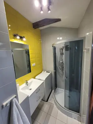 a bathroom with a shower and a sink and a mirror at Golden Middle Point - best location in Krakow in Kraków