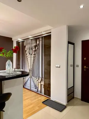 a room with a hallway with a view of a building at Modern Apartament in Kraków's Urban District in Kraków