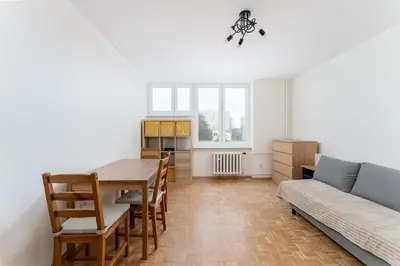 a living room with a table and a couch at Czepca Quiet Corner Studio by BookingHost in Kraków