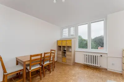 a dining room with a table and chairs and a window at Czepca Quiet Corner Studio by BookingHost in Kraków