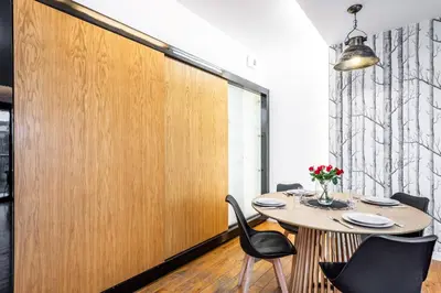 a dining room with a table and chairs at ShortStayPoland Grzegórzecka C6 in Kraków