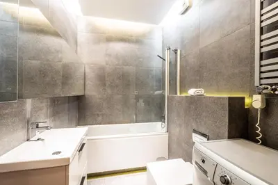 a bathroom with a sink and a toilet and a tub at ShortStayPoland Grzegórzecka C6 in Kraków