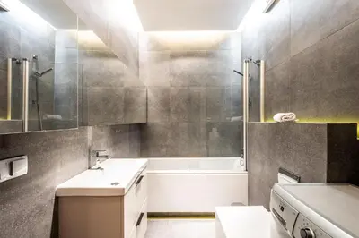a bathroom with a sink and a bath tub at ShortStayPoland Grzegórzecka C6 in Kraków