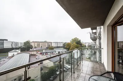 a balcony with a view of a parking lot at ShortStayPoland Grzegórzecka C6 in Kraków