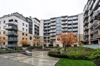 a courtyard in front of some tall buildings at ShortStayPoland Grzegórzecka C6 in Kraków