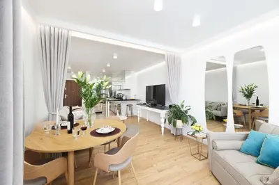 a living room with a table and a couch at Riva Verona Apartment 86 in Kraków