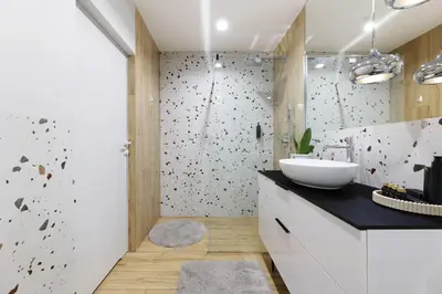 a bathroom with a sink and a shower at Riva Verona Apartment 86 in Kraków