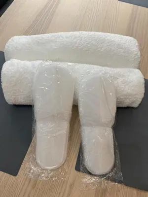 two rolls of toilet paper sitting on a table at Zakrzówek Apartament z Jacuzzi in Kraków