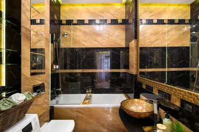 a bathroom with a tub and a sink and a toilet at Discover Krakow Apartments - 8 Rakowicka St - Stylish Balcony Apartment with Netflix in Kraków
