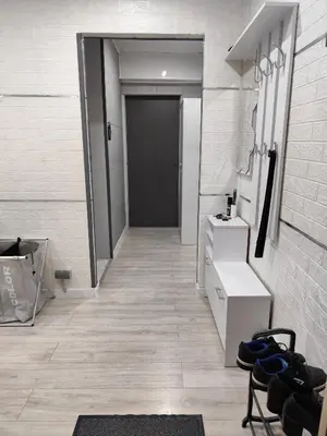 a room with a hallway with a bathroom with a door at Albertyńskie House in Kraków