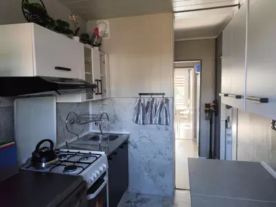 a kitchen with a stove and a sink in it at Albertyńskie House in Kraków