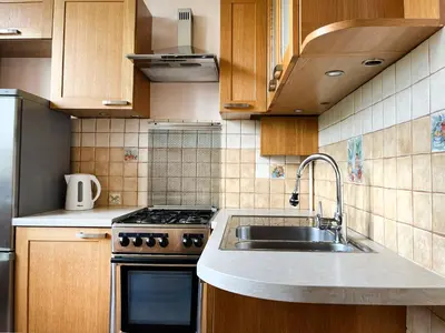 a kitchen with a sink and a stove at Cozy Two Bedrooms Apartment in Cracow City in Kraków