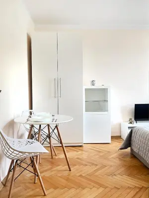 a living room with a table and chairs at Cozy Two Bedrooms Apartment in Cracow City in Kraków