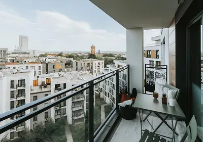 a balcony with a view of a city at Rakowicka Modern Apartment with Air Conditioning in City Center by Noclegi Renters in Kraków