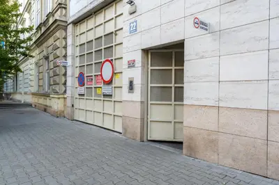 an empty street in front of a building at Cracow Home Harmony Apartment by BookingHost in Kraków