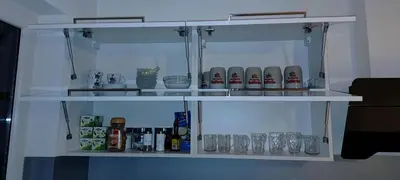a white shelf with glasses on it at Dworek pod Jeżową Wodą in Młyńczyska